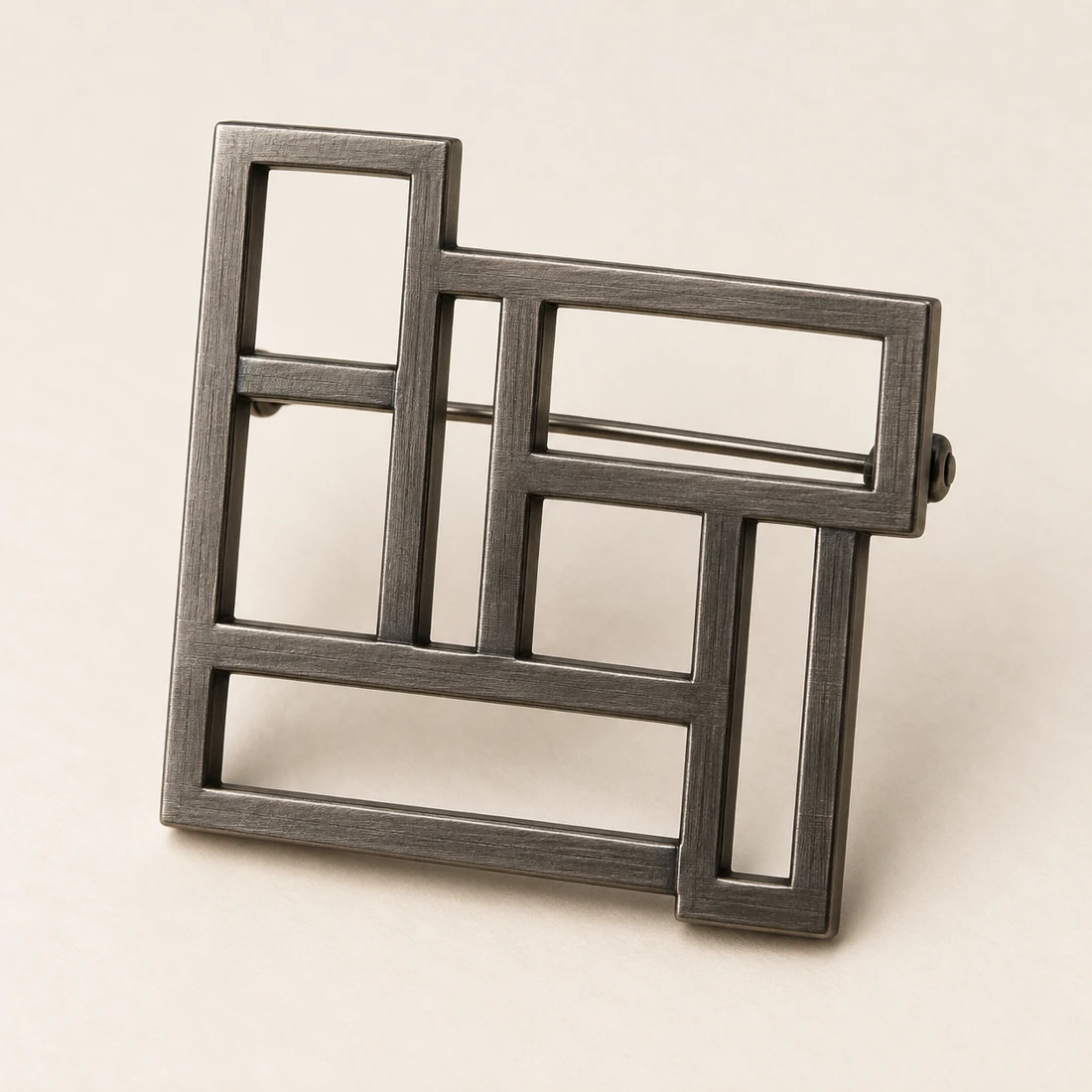 Offset Grid Brooch, gunmetal, geometric openwork design